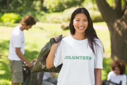 Community volunteers setting up a nonprofit event with insurance safeguarding against fraud and data breaches