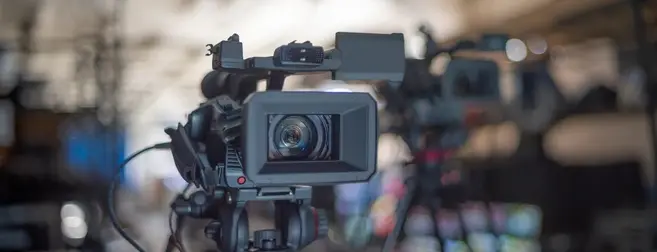 Photographer capturing images at a wedding, representing gig worker insurance for creatives and event professionals.