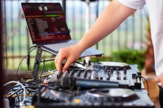  &#34;DJ performing at a private party, representing liability insurance coverage for entertainers and music professionals.